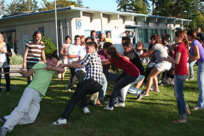 International Program Students enjoying a game of tug-of-war during fall quarter orientation