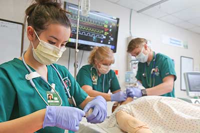 Students in respiratory care program in lab class